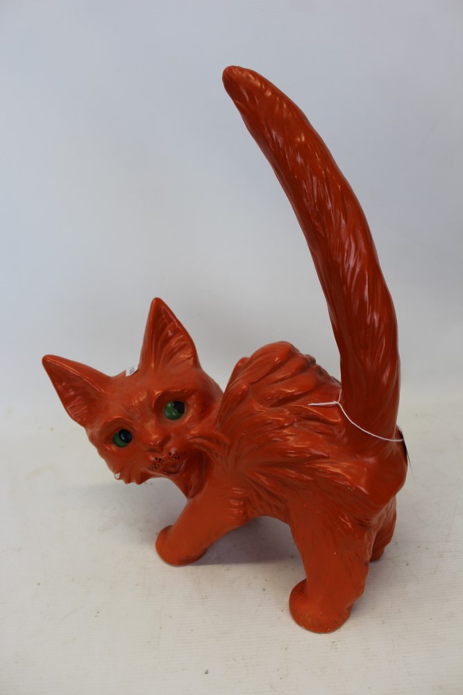 Mid twentieth-century pottery ornament of an over characterful cat with orange glazed body and