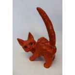 Mid twentieth-century pottery ornament of an over characterful cat with orange glazed body and