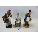 Three Royal Doulton figures - Carpet Seller HN1464, The Mask Seller HN2103 and Embroidering HN2855