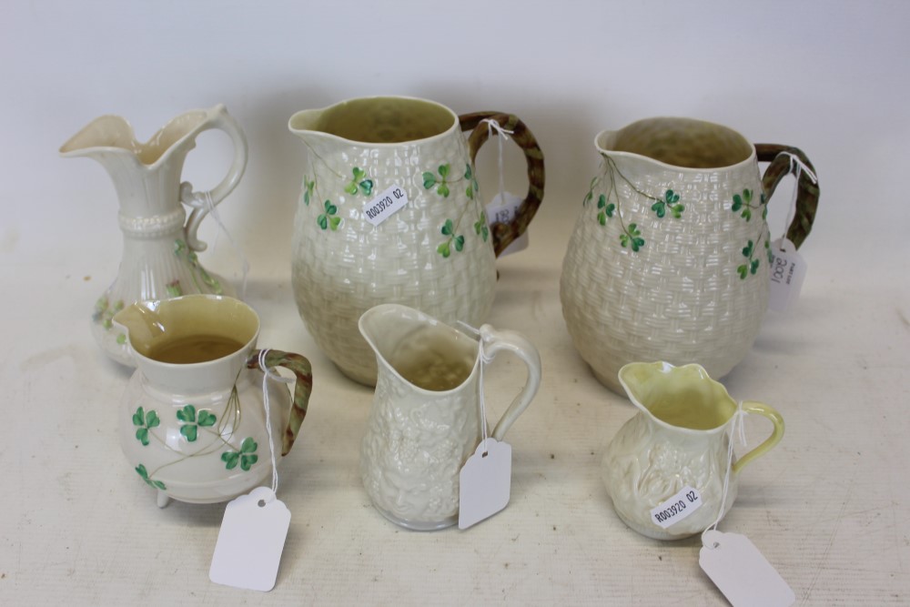 Group of six Belleek porcelain jugs