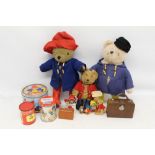 Group Paddington Bear items including bear by Gabrielle Designs wearing yellow Wellington boots,