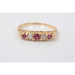 Diamond and ruby five stone ring with three round mixed cut rubies interspaced with two old cut