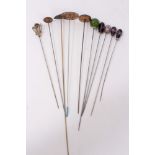 Group of eleven Edwardian and later enamel and glass mounted hatpins