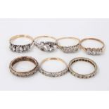 Seven gold and silver dress rings with synthetic white stones