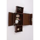 Leather jewellery box containing silver pocket watch, silver vesta case, paste set bracelet, gold