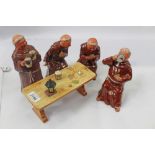 Bretby pottery Figure group of four Monks at a Game of Cards