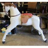 Antique painted wood rocking horse figure, dapple grey finish, now lacking base, 92cm long