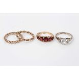 Gold (9ct) garnet ring and three other rings (4)