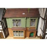 Three children's doll houses.