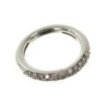 White gold and diamond ring with a half hoop of pavé set diamonds estimated to weigh approximately