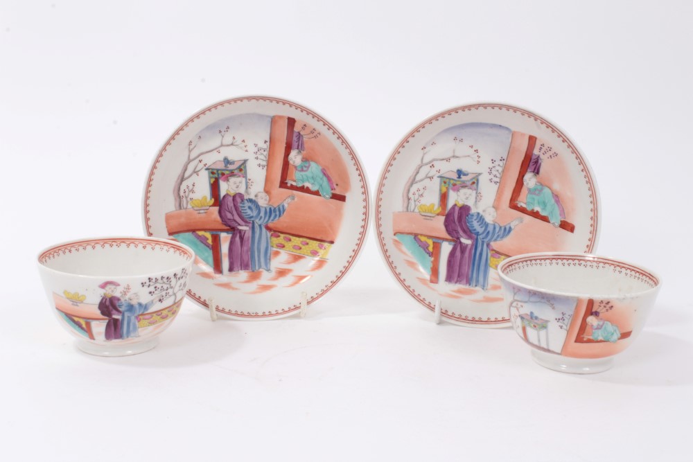 A pair of New Hall type 'Boy at the Window' pattern tea bowls and saucers, circa 1800