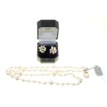 Cultured pearl and silver necklace and similar earrings
