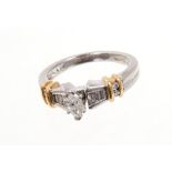 Diamond and platinum ring with a marquise cut diamond flanked by graduated baguette cut diamonds in