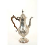 Good quality George III silver coffee pot with embossed decoration London 1781
