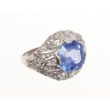 Art Deco sapphire and diamond ring with an octagonal facet cut cornflower blue sapphire measuring
