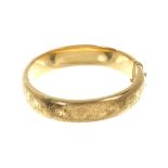 9ct gold hinged bangle.