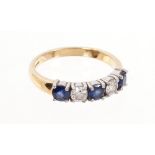 Diamond and sapphire five stone ring with two round brilliant cut diamonds and two round mixed cut