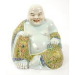 Late 19th century Chinese famille rose figure of Butal, the corpulent monk