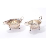 Two silver sauce boats of typical form