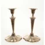 Pair of Edwardian silver candle sticks of shaped oval form.
