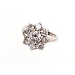 Diamond cluster ring with a flower head cluster of nine brilliant cut diamonds estimated to weigh