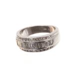 Platinum and diamond ring with a wide band of baguette cut diamonds diamonds flanked by a border of