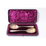 Pair of Victorian silver serving spoons with engraved bowls in original fitted case