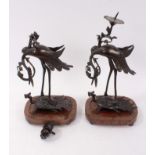 A pair of 19th century Japanese bronze candlesticks