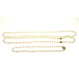 Two cultured pearl necklaces.