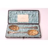 Pair of Victorian silver berry spoons in fitted case
