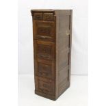 Early twentieth century oak filing cabinet with two short and four long drawers with metal handles