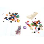 Four packets of unmounted gemstones to include cultured pearls