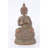 Antique Tibetan bronze figure of a seated Buddha, on stepped plinth, 10cm high