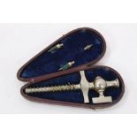 Early 20th century white metal champagne tap, in leather covered case
