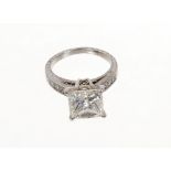 Fine diamond single stone ring with a princess cut diamond weighing 4.00 carats, accompanied by a