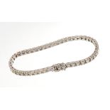 Diamond tennis bracelet with a line of princess cut diamonds in 18ct white gold setting