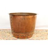 Antique copper vessel, riveted form with everted rim, 45cm diameter