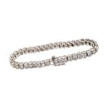 Diamond tennis bracelet with a line of 43 brilliant cut diamonds estimated to weigh approximately 6.