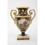 Good Quality Early 19th Century Derby two handled pedestal vase, painted with a named view of 'In