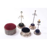 Four silver and one silver plated pin cushions and hat pin holders (5)