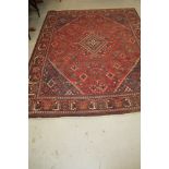Tabriz style carpet, with central serrated medallion and scattered floral motifs in multiple