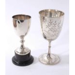 Victorian silver goblet with engraved foliate decoration, together with a silver trophy.