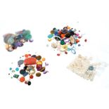 Four packets of unmounted gemstones to include cultured pearls