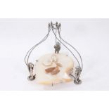 Unusual table centrepiece with two loose pearl items and spear barbs