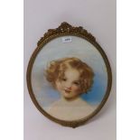 English school, circa 1900, oval pastel - study of a pretty girl with auburn hair, in gilt frame,