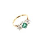 Ladies diamond and emerald three stone ring