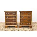 Pair of Georgian style walnut finished bedside chests of four drawers with brass handles on bracket