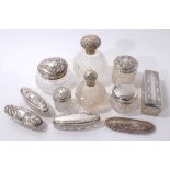 Collection of ten silver mounted cut glass perfume bottles and vanity jars.