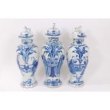 Garniture of three Chinese Blue and White Porcelain vases and covers with Figural decoration, one