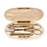 Good early 19th century French ivory cased etui, complete with gold and silver fittings within oval
